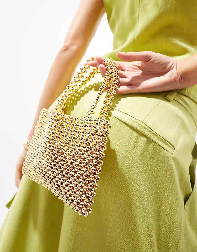 https://images.asos-media.com/products/asos-design-beaded-mini-ball-grab-clutch-bag-in-gold/206561350-3?$n_750w$&wid=750&fit=constrain
