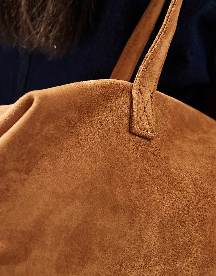 https://images.asos-media.com/products/pasq-faux-suede-long-shoulder-bag-in-tan/207896670-4?$n_750w$&wid=750&fit=constrain
