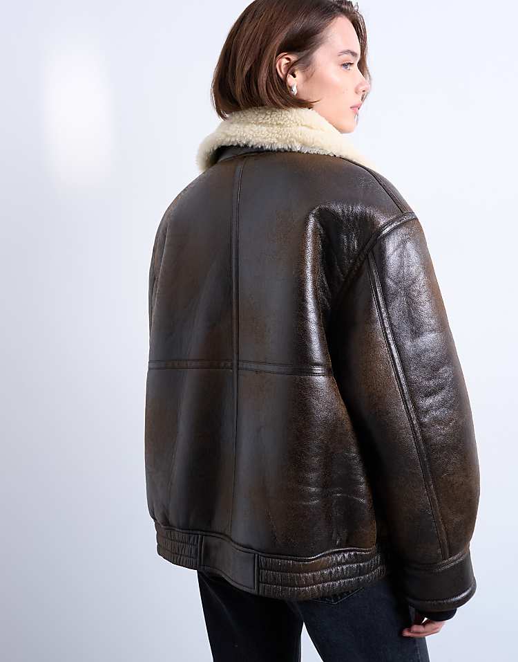 https://images.asos-media.com/products/topshop-oversized-tab-detail-shearling-bomber-in-brown/208044394-4?$n_750w$&wid=750&fit=constrain
