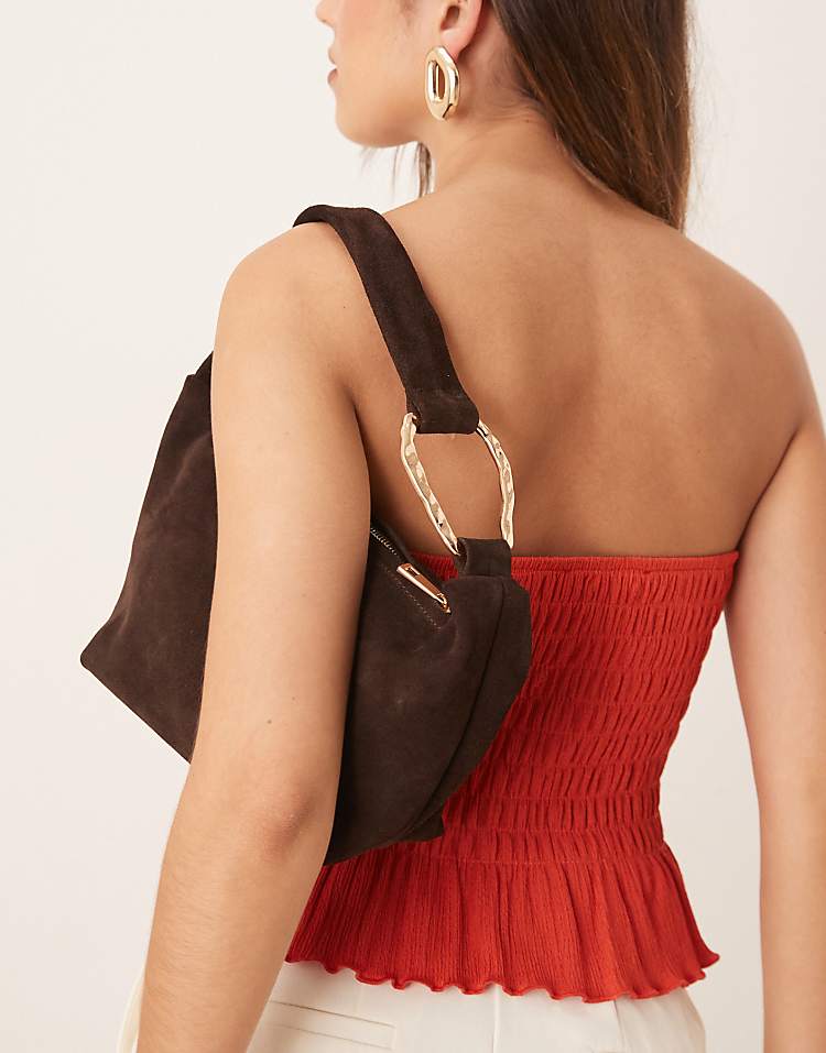 https://images.asos-media.com/products/asos-design-suede-grab-shoulder-bag-with-hardware-detail-in-chocolate/208228449-3?$n_750w$&wid=750&fit=constrain