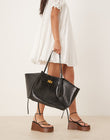 https://images.asos-media.com/products/gina-tricot-faux-leather-medium-tote-bag-with-strap-and-clutch-detail-in-black-croc/208423991-1-black?$n_750w$&wid=750&fit=constrain