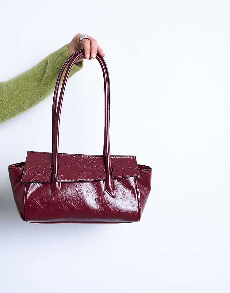 https://images.asos-media.com/products/topshop-sunny-shoulder-bag-with-asymmetric-flap-in-burgundy/208433511-2?$n_750w$&wid=750&fit=constrain