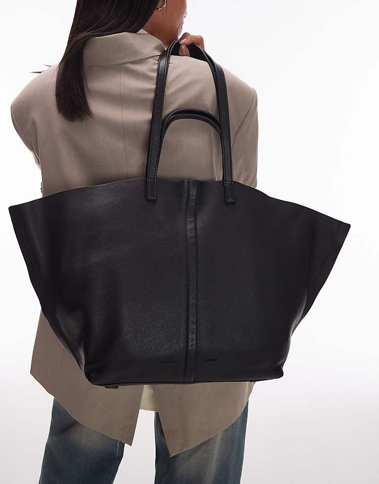 https://images.asos-media.com/products/allsaints-phoenix-tote-in-black/208452284-4?$n_750w$&wid=750&fit=constrain