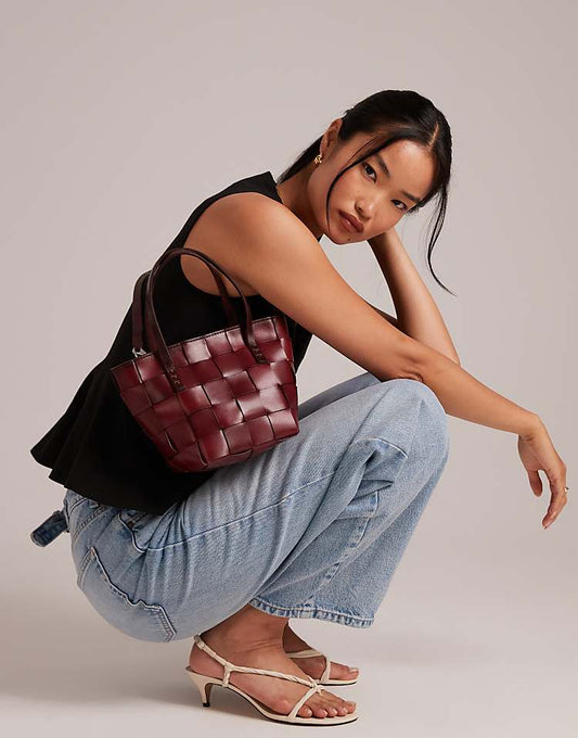https://images.asos-media.com/products/dragon-diffusion-japan-mini-woven-leather-top-handle-bag-in-burgundy/208481422-1-burgundy?$n_750w$&wid=750&fit=constrain