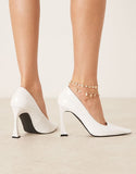 https://images.asos-media.com/products/raid-aleener-heeled-court-shoes-in-white-patent/208592013-3?$n_750w$&wid=750&fit=constrain