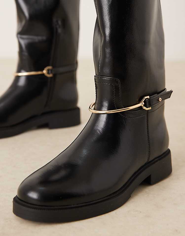 https://images.asos-media.com/products/asos-design-wide-fit-cole-flat-riding-knee-boot-in-black-with-trim/208609734-2?$n_750w$&wid=750&fit=constrain