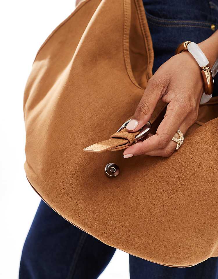 https://images.asos-media.com/products/stradivarius-slouchy-faux-suede-buckle-detail-bag-in-tan/208635322-2?$n_750w$&wid=750&fit=constrain