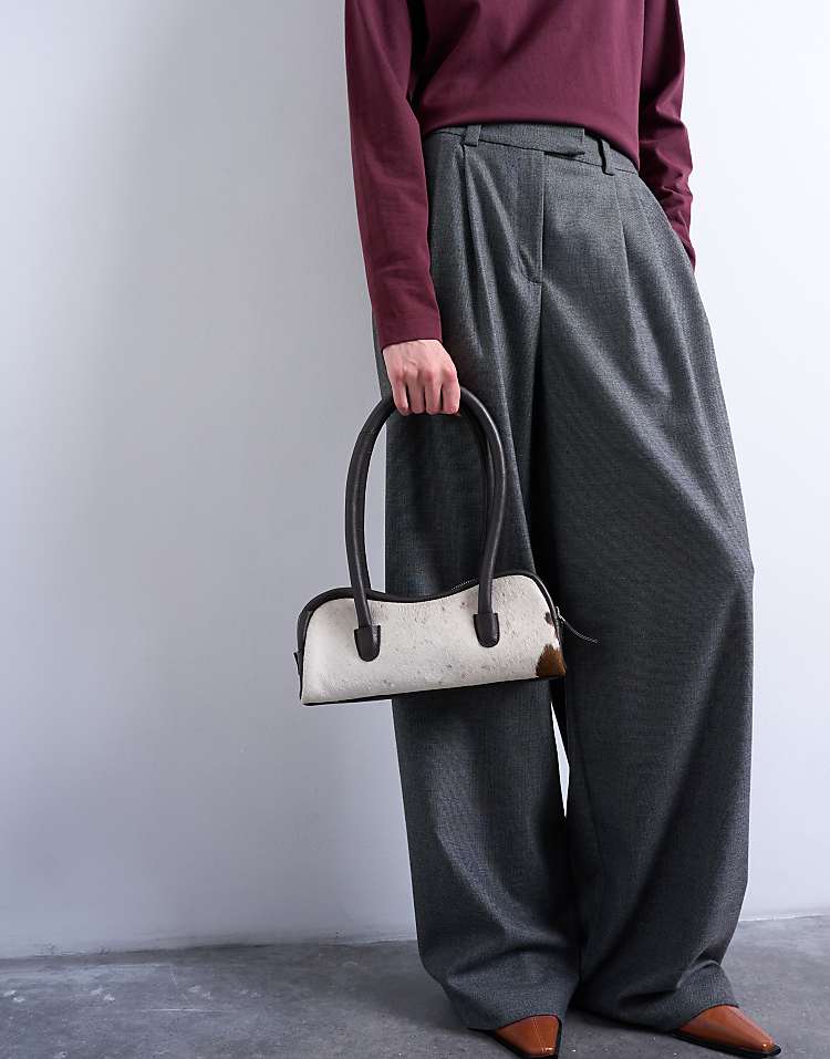 https://images.asos-media.com/products/topshop-sullivan-real-leather-shoulder-bowler-bag-in-cow-print-pony/208748103-4?$n_750w$&wid=750&fit=constrain