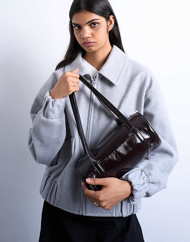 https://images.asos-media.com/products/topshop-salma-bowler-bag-in-chocolate-patent/208782182-3?$n_750w$&wid=750&fit=constrain