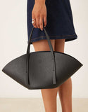 https://images.asos-media.com/products/gina-tricot-faux-leather-small-wide-shopper-bag-in-black/208803818-1-black?$n_750w$&wid=750&fit=constrain