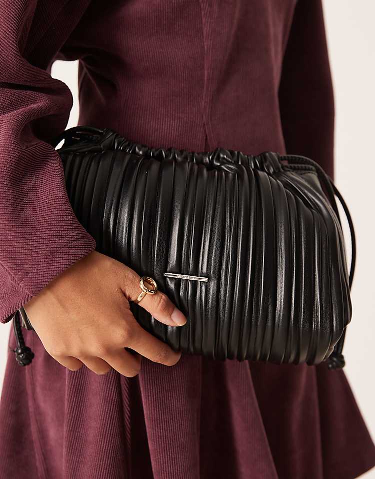 https://images.asos-media.com/products/calvin-klein-plisse-drawstring-shoulder-bag-in-black/208894560-2?$n_750w$&wid=750&fit=constrain