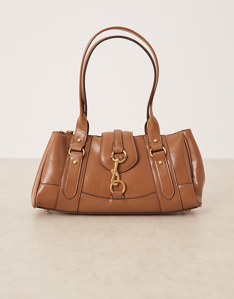 https://images.asos-media.com/products/mango-retro-bowler-shoulder-bag-with-clasp-detail-in-toffee/209160668-3?$n_750w$&wid=750&fit=constrain