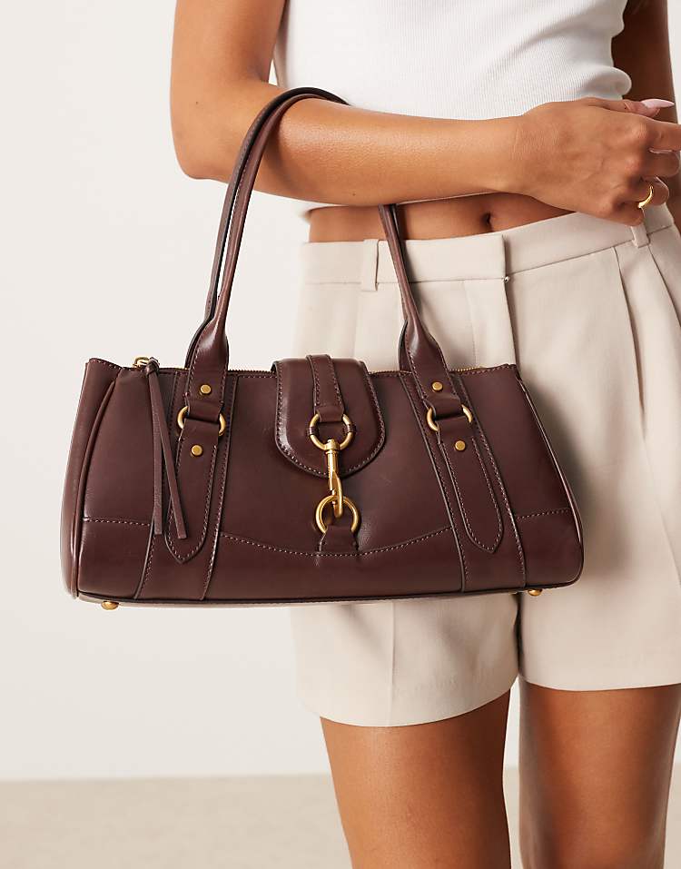 https://images.asos-media.com/products/mango-retro-bowler-shoulder-bag-with-clasp-detail-in-dark-brown/209160745-1-darkbrown?$n_750w$&wid=750&fit=constrain