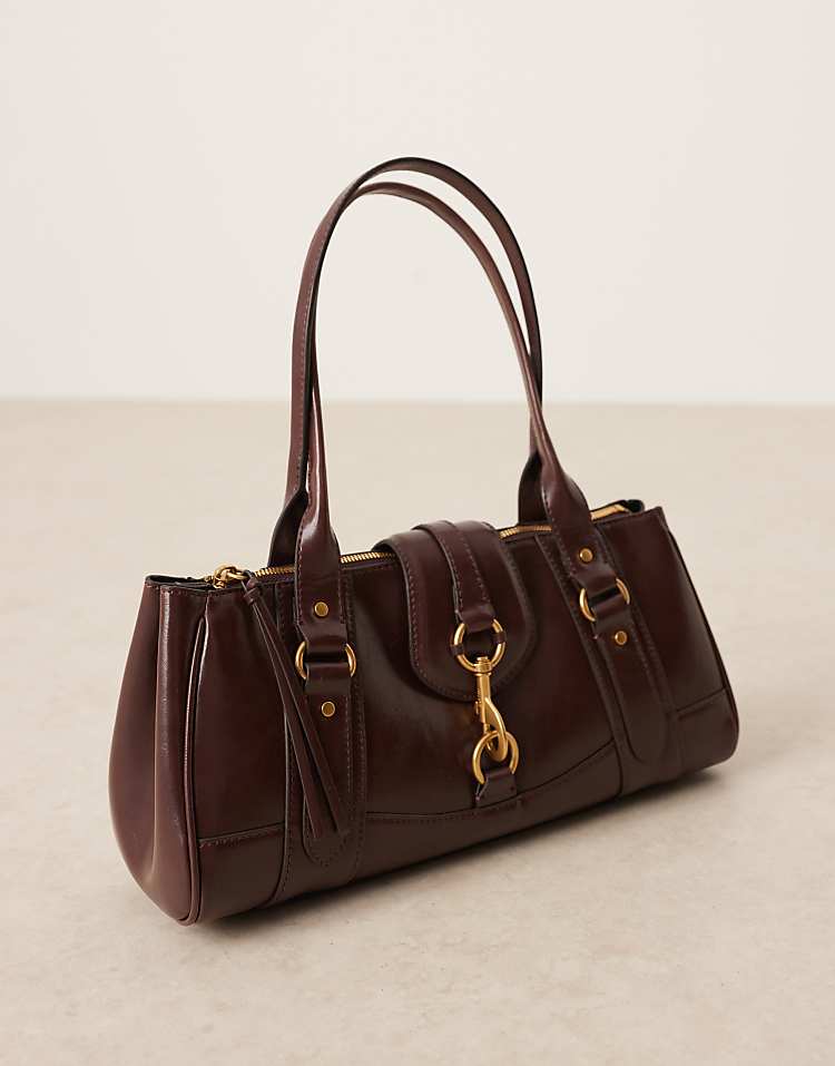https://images.asos-media.com/products/mango-retro-bowler-shoulder-bag-with-clasp-detail-in-dark-brown/209160745-2?$n_750w$&wid=750&fit=constrain
