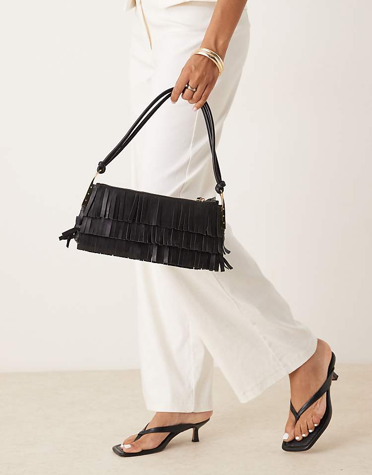 https://images.asos-media.com/products/mango-leather-fringed-hand-bag-with-gold-accents-in-black/209160892-1-black?$n_750w$&wid=750&fit=constrain