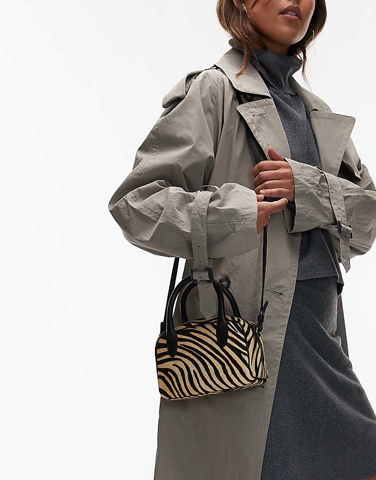 https://images.asos-media.com/products/other-stories-hairy-zebra-print-leather-nano-bowling-bag-in-white-multi/209264600-4?$n_750w$&wid=750&fit=constrain
