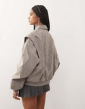 https://images.asos-media.com/products/lioness-exclusive-vista-leather-look-contrast-stitch-bomber-jacket-in-taupe/209290649-4?$n_750w$&wid=750&fit=constrain