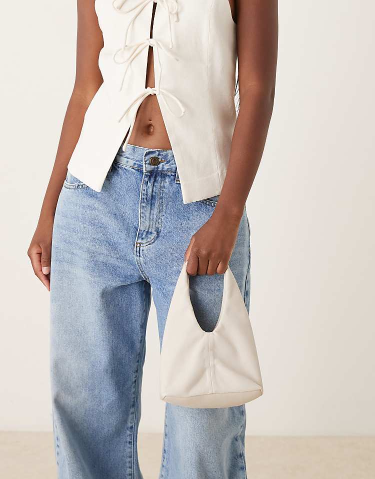 https://images.asos-media.com/products/mango-faux-leather-slouchy-bag-with-gold-statement-handle-in-cream/209445459-2?$n_750w$&wid=750&fit=constrain