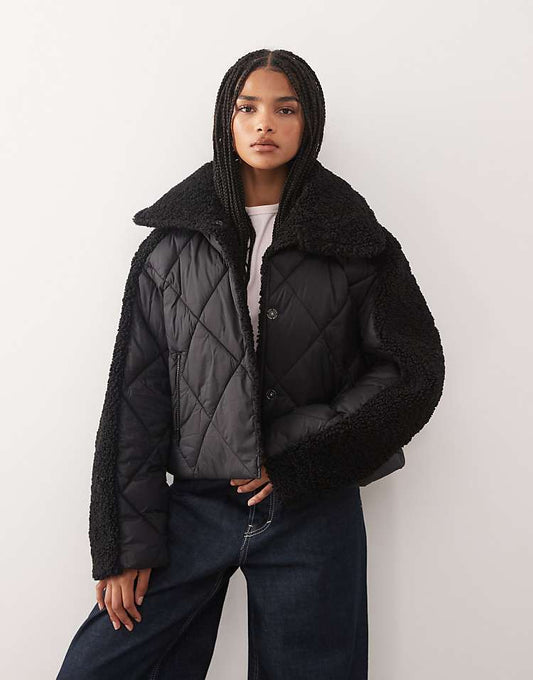 https://images.asos-media.com/products/noisy-may-collar-detail-quilted-short-coat-with-teddy-insert-in-black/209562933-1-black?$n_750w$&wid=750&fit=constrain